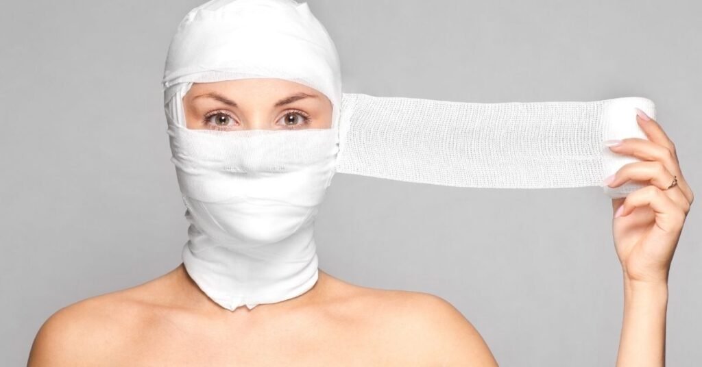 A woman with medical tissue wrapped around her face.